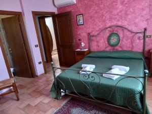 A bed or beds in a room at Agriturismo Il Borghetto