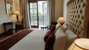 Postel nebo postele na pokoji v ubytování DLF Club 4 + 17 fotografií