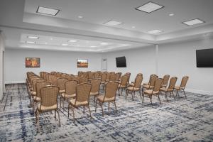 a large room with a bunch of chairs in it at Homewood Suites by Hilton Irving-DFW Airport in Irving +40 photos