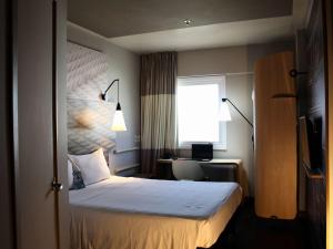 Cama ou camas em um quarto em ibis Natal