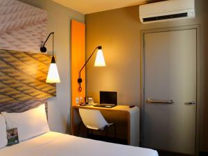 Cama ou camas em um quarto em ibis Natal