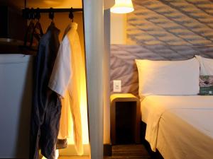 Cama ou camas em um quarto em ibis Natal