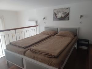 Postel nebo postele na pokoji v ubytování Loft House Budapest