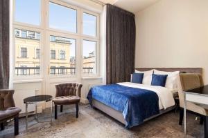 Posteľ alebo postele v izbe v ubytovaní Wyndham Grand Krakow Old Town