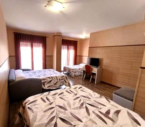 Postel nebo postele na pokoji v ubytování Hotel Pio XII Jumilla