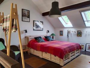 a bedroom with a large bed with a red blanket at Guesthouse Silvani in Kruševac +107 photos