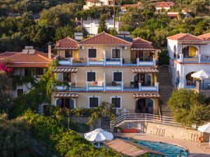 a view of a villa with a swimming pool at Pantheon Apartments & Studios in Marathokampos