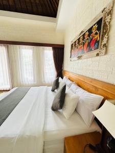 Postel nebo postele na pokoji v ubytování Gangga Guest House