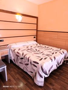 Postel nebo postele na pokoji v ubytování Hotel Pio XII Jumilla
