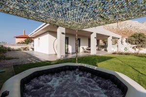 a pool in the yard of a house at Blue Lagoon Villa in Stavros