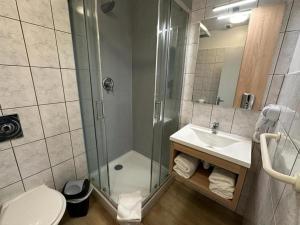 Koupelna v ubytování Hôtel NOROTEL