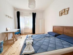 a bedroom with a bed with a dog laying on it at Perfect Long-term Stay Stylish and Spacious Top Center Next to Vitosha Blvd in Sofia