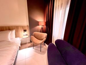 Hôtel Le Manoir客房内的一张或多张床位