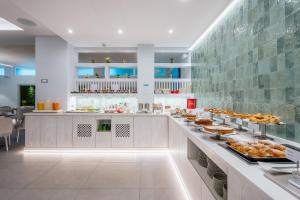 a buffet in a restaurant with food on display at Hotel Gardenia Sorrento, Ascend Hotel Collection in Sorrento