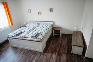 Postel nebo postele na pokoji v ubytování Vítovský statek