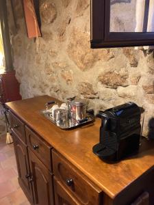 a wooden counter with a tray of food on it at Casa Rural Los Cuartos de Gredos in Los Cuartos +31 photos