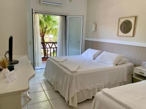 Cama ou camas em um quarto em Hotel Pousada Solar do Parcel