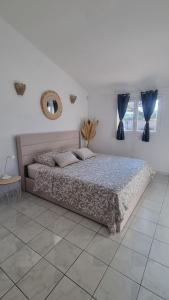 Postel nebo postele na pokoji v ubytování Chambre face aux vignes