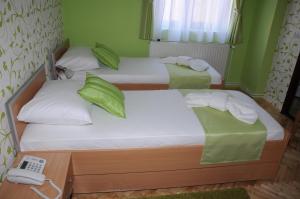 Voodi või voodid majutusasutuse Garni Hotel Laguna Lux toas