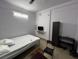 Raj Andar Guest House客房内的一张或多张床位