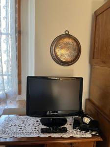 a computer monitor sitting on top of a table at Ca' Rivella - paceful country living in Villa dʼAiano