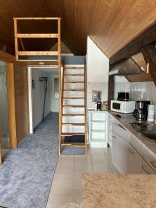 a kitchen with a loft bed in a kitchen at Ferienwohnung Insel Malchow mit eigenem Bootsanleger in Malchow