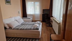 Postel nebo postele na pokoji v ubytování Guest House Garbevi