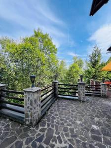 a fence with lights on top of a patio at Ski Chalet Sinaia in Sinaia +21 photos
