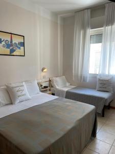 Postel nebo postele na pokoji v ubytování Hotel Soave