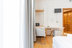 TV a/nebo společenská místnost v ubytování Hotel Regina