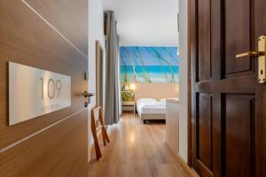 Postel nebo postele na pokoji v ubytování Hotel Regina