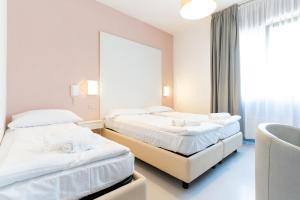 Postel nebo postele na pokoji v ubytování Hotel Regina