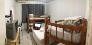 Postel nebo postele na pokoji v ubytování Hotel Laçador