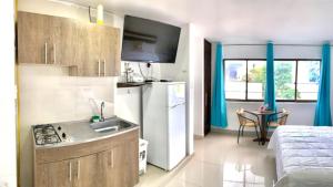 Kuchyň nebo kuchyňský kout v ubytování Apartahotel Bahia Tropical III