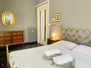 Posteľ alebo postele v izbe v ubytovaní GASTALDI ROOMS - Old Style