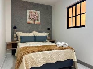 Postel nebo postele na pokoji v ubytování Provenza Medellin Hotel Boutique