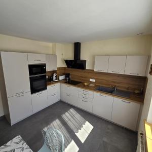 Cucina o angolo cottura di Gîte A l'ombre du clocher
