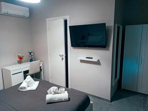 TV a/nebo společenská místnost v ubytování Le Mirage