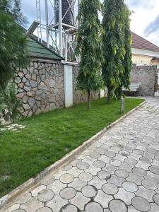a stone walkway in front of a house at Lesley and Lindsey luxurious short let in Gwarinpa