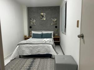 Postel nebo postele na pokoji v ubytování Provenza Medellin Hotel Boutique