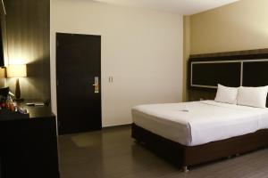 Postel nebo postele na pokoji v ubytování Rado Hotel - Santa María