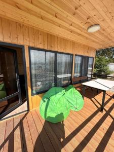 a room with a table and a green bean bed at Sevanta Lake Cottages in Sevan +11 photos
