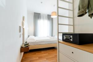 Postel nebo postele na pokoji v ubytování Hotel Regina
