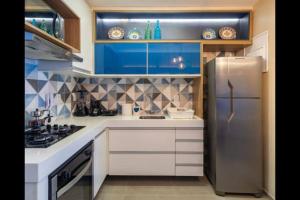 Kuchyň nebo kuchyňský kout v ubytování Cupe Beach Living - Flat Luxo 2 suítes decorado térreo frente piscina + 8 fotografií
