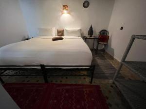 Postel nebo postele na pokoji v ubytování Riad Fes EL KAID
