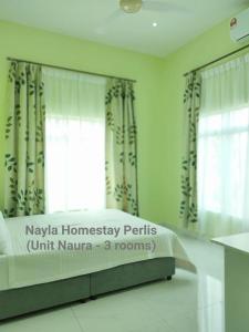 Katil atau katil-katil dalam bilik di NAYLA Homestay Perlis - Unit NAURA
