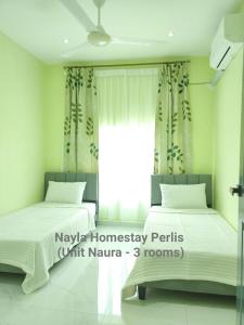Katil atau katil-katil dalam bilik di NAYLA Homestay Perlis - Unit NAURA