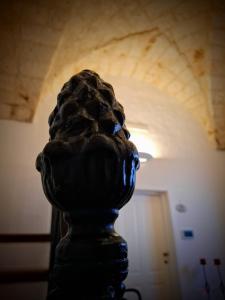 a statue of a lion in front of a hallway at Palazzo Vaglio in Alliste