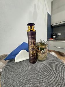 a bottle sitting on top of a table at La Casa di Jennifer nel centro in Parma