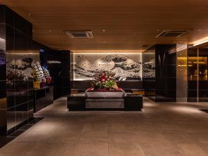 Area soggiorno di APA Hotel Shin Osaka Eki Tower